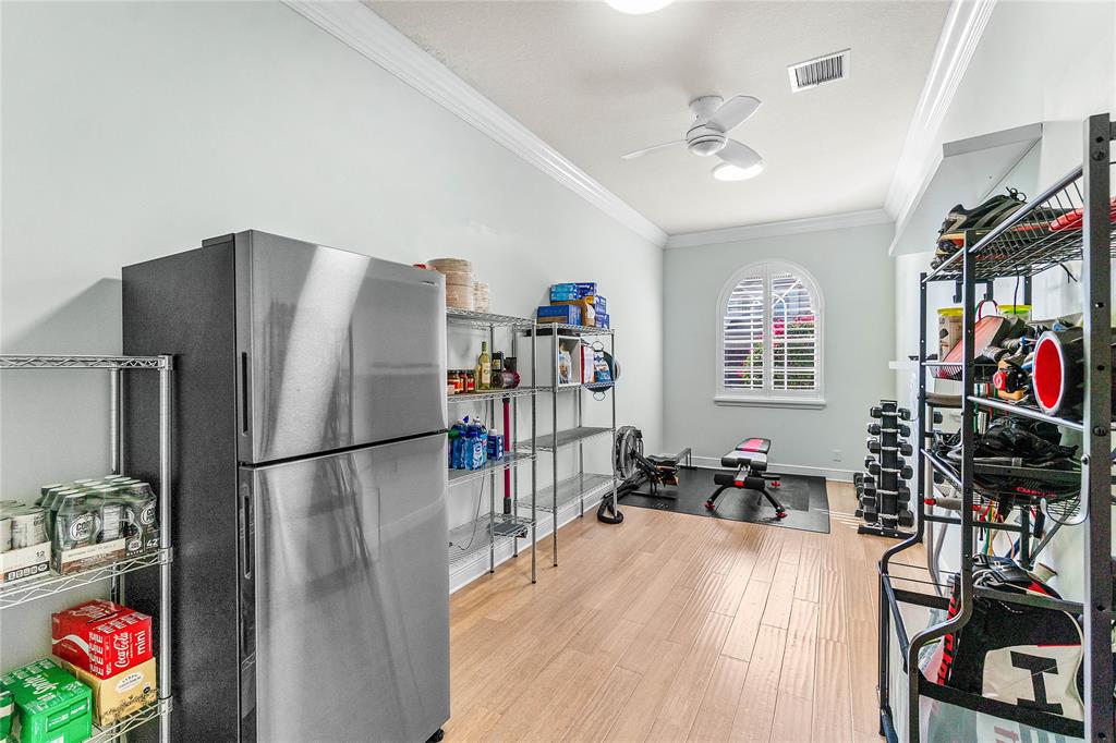 6375 Bellamalfi Street Boca Raton, FL 33496 - Photo 18 of 25 a kitchen with stainless steel appliances a refrigerator and a wooden floor