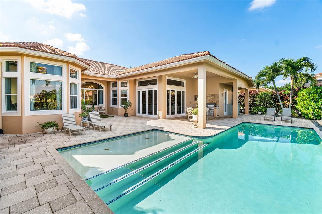 6375 Bellamalfi Street Boca Raton, FL 33496 - Photo 24 of 25 a view of a house with a swimming pool and sitting area