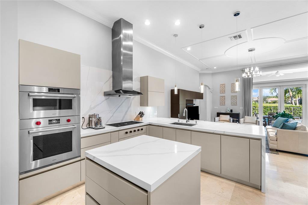 6375 Bellamalfi Street Boca Raton, FL 33496 - Photo 10 of 25 a kitchen with a sink a stove and oven