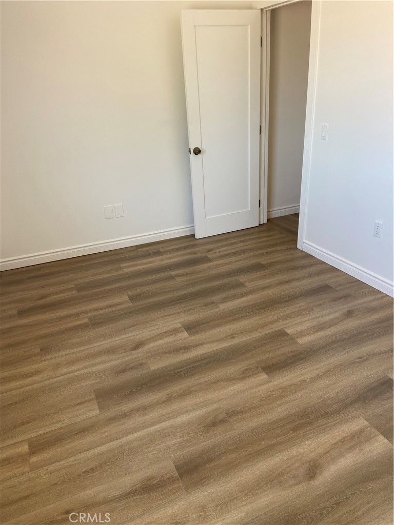69626 Brant Cross Road Twentynine Palms, CA 92277 - Photo 14 of 33 an empty room with wooden floor