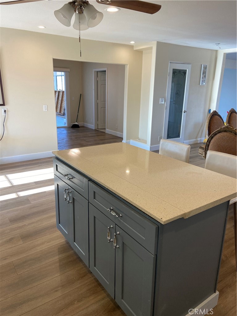 69626 Brant Cross Road Twentynine Palms, CA 92277 - Photo 19 of 33 a kitchen with a cabinets and chandelier