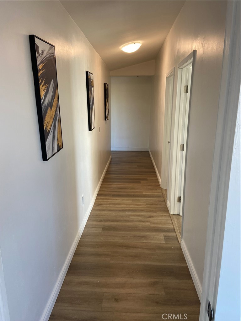 69626 Brant Cross Road Twentynine Palms, CA 92277 - Photo 22 of 33 a view of a hallway with wooden floor