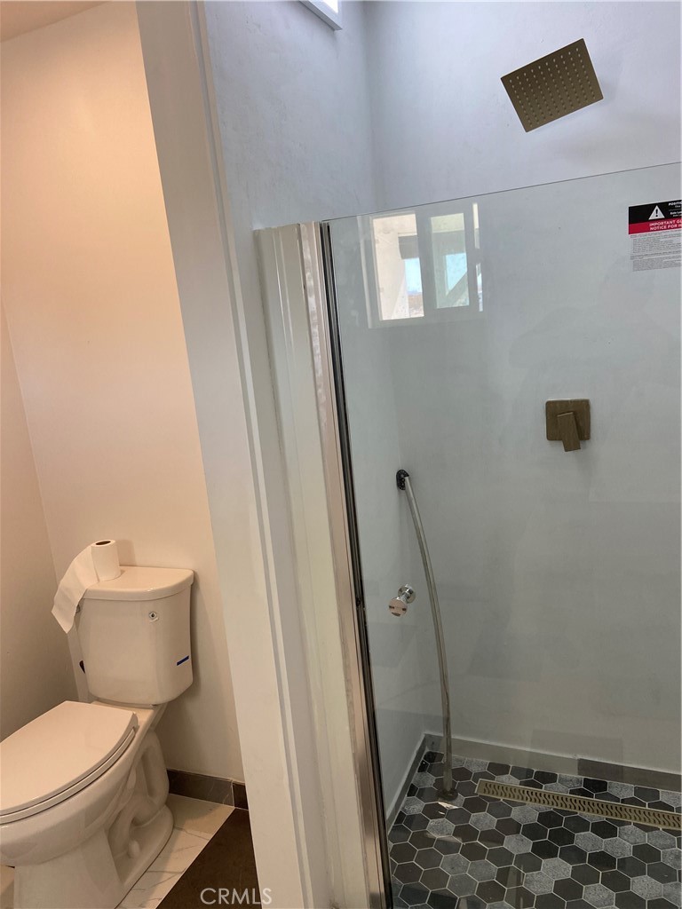 69626 Brant Cross Road Twentynine Palms, CA 92277 - Photo 26 of 33 a bathroom with a toilet and a shower