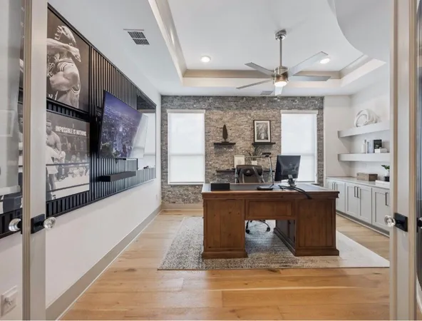 a living room with stainless steel appliances kitchen island granite countertop furniture and a kitchen view