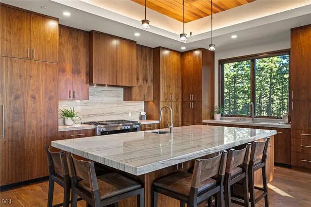 a dining table with chairs and window