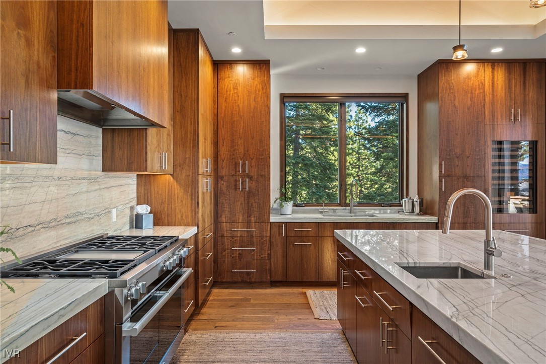 823 Ellen Court Incline Village, NV 89451 - Photo 18 of 45 a kitchen with granite countertop a stove a sink and a refrigerator