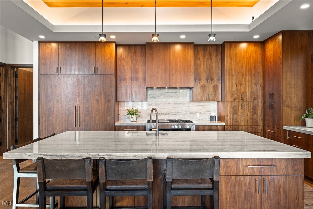 823 Ellen Court Incline Village, NV 89451 - Photo 19 of 45 a kitchen with kitchen island granite countertop a table chairs sink and cabinets