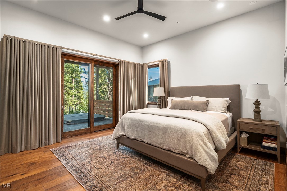 823 Ellen Court Incline Village, NV 89451 - Photo 24 of 45 a spacious bedroom with a large bed and a window