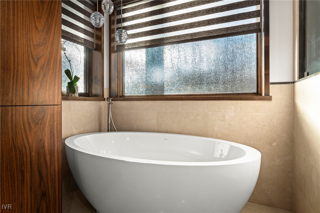 823 Ellen Court Incline Village, NV 89451 - Photo 25 of 45 a white tub sitting in a bathroom next to a window