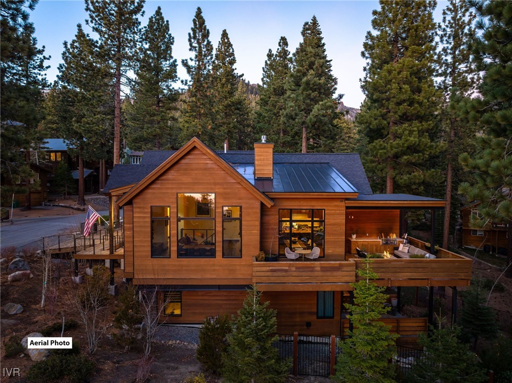 823 Ellen Court Incline Village, NV 89451 - Photo 3 of 45 a front view of house with yard and trees in the background