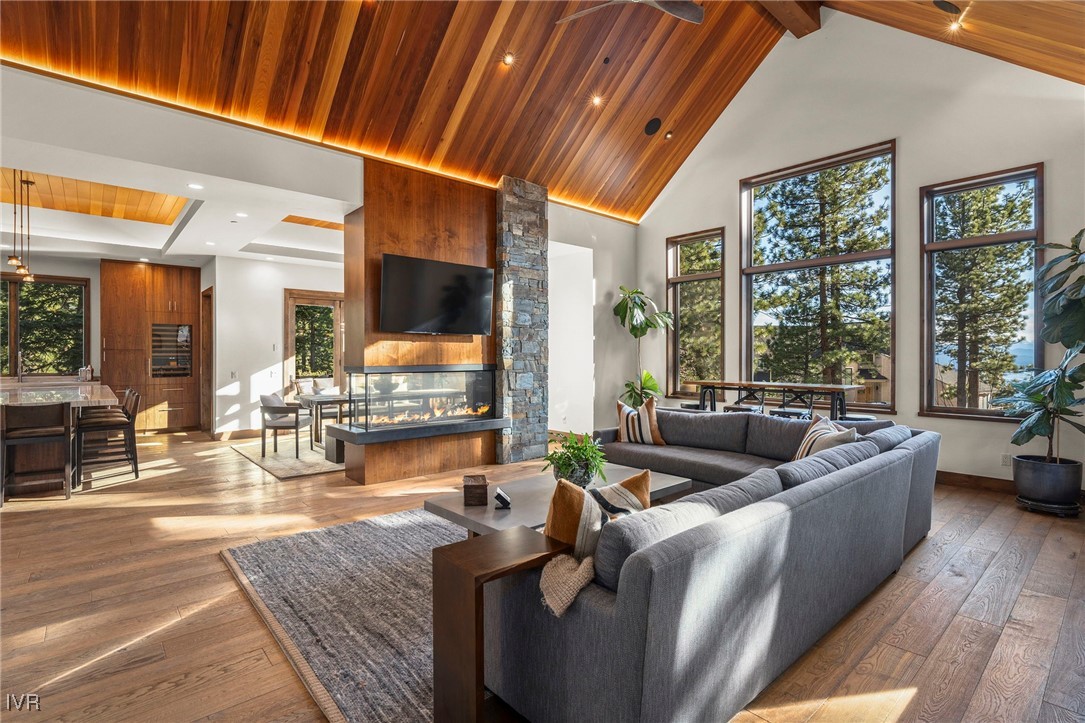 823 Ellen Court Incline Village, NV 89451 - Photo 8 of 45 a living room with fireplace furniture and a large window
