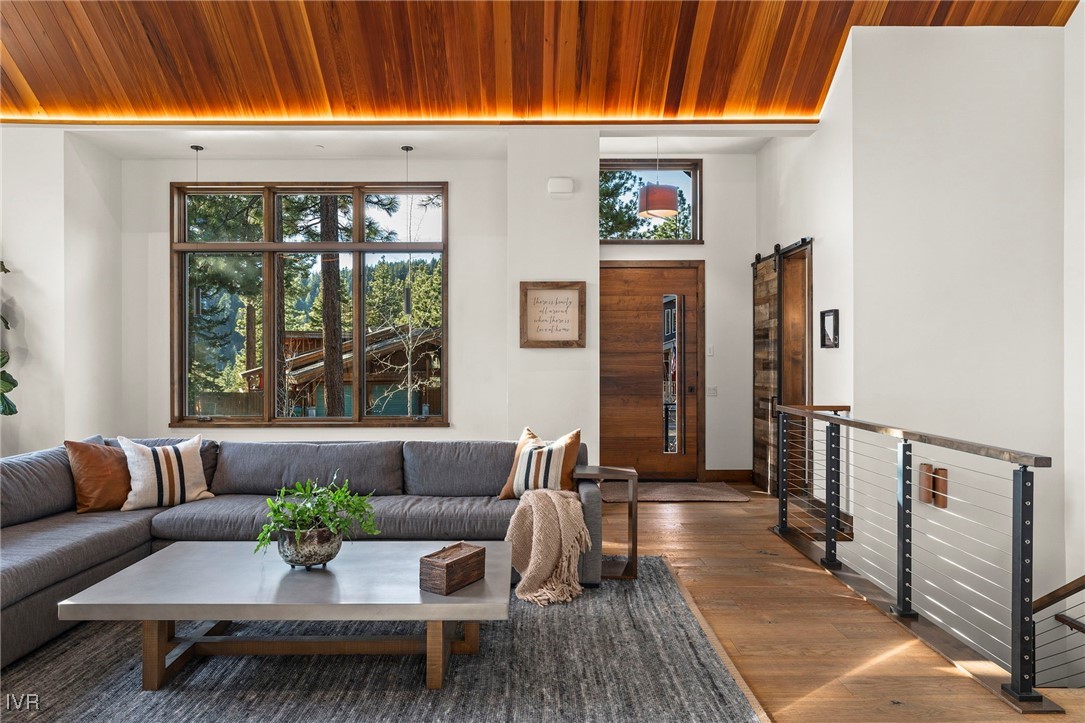 823 Ellen Court Incline Village, NV 89451 - Photo 9 of 45 a view of a patio with couches and potted plants with wooden floor