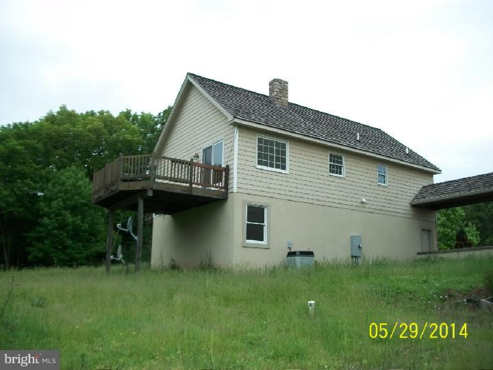 497 Cafferty Road Erwinna, PA 18920 - Photo 22 of 25 a front view of a house with a garden