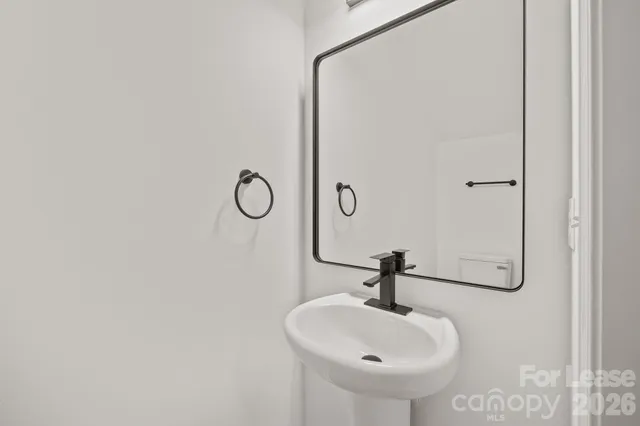 a bathroom with a sink and mirror
