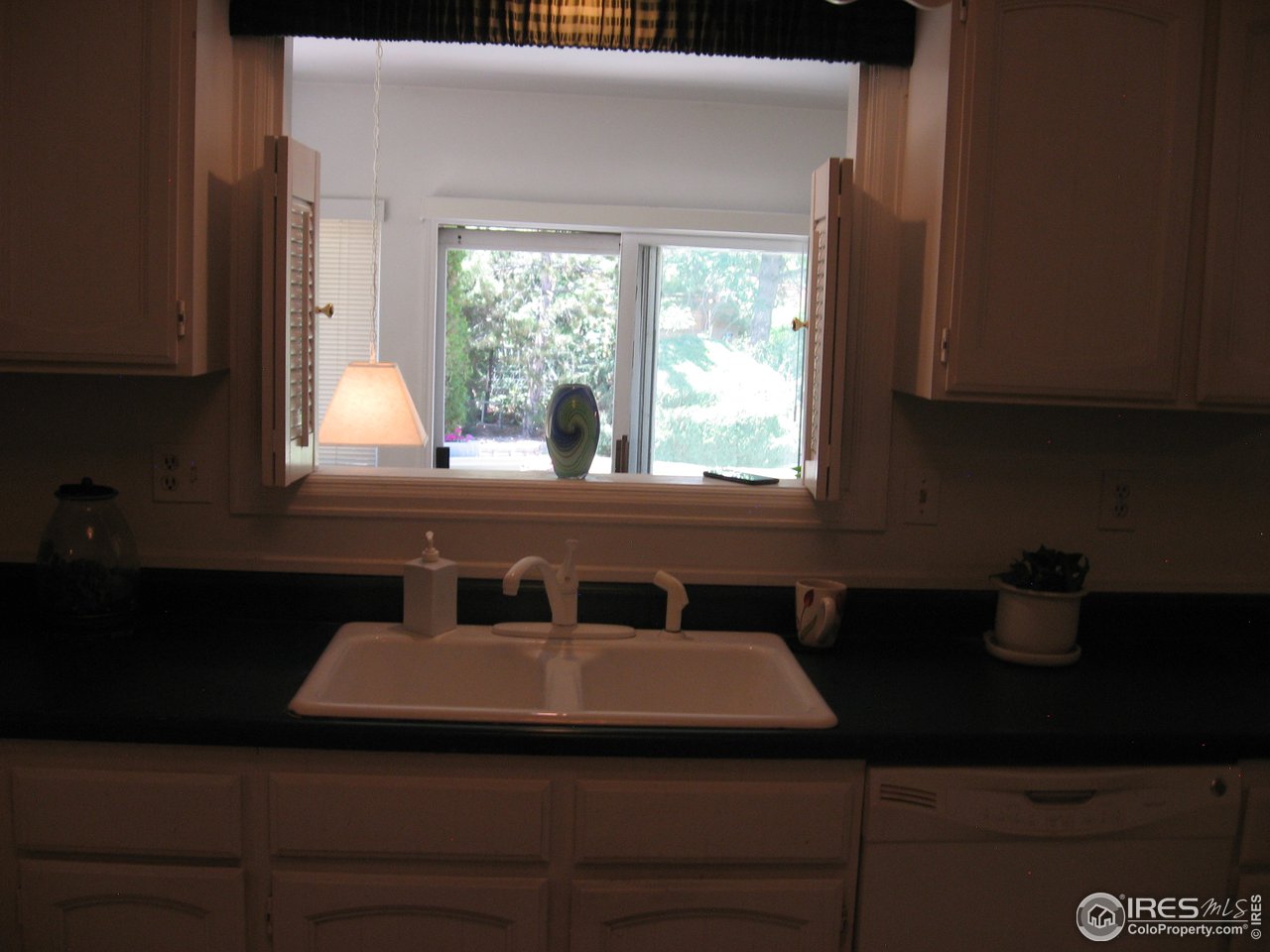 2512 Hawthorne Road Fort Collins, CO 80524 - Photo 12 of 31 Kitchen looking into sun room