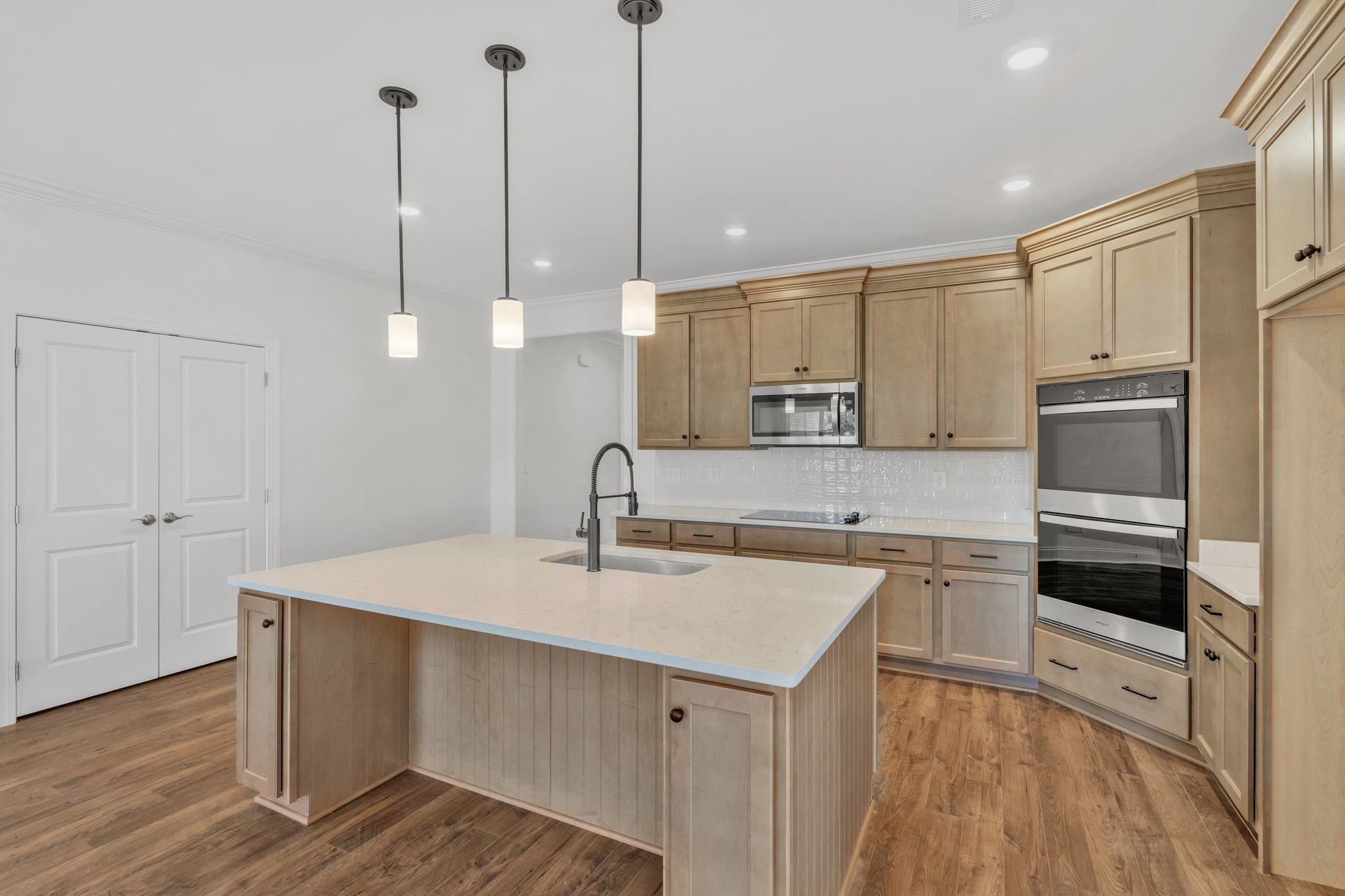 7505 Shoal Mill Point Fairview, TN 37062 - Photo 11 of 55 a kitchen with a sink a counter space appliances and cabinets
