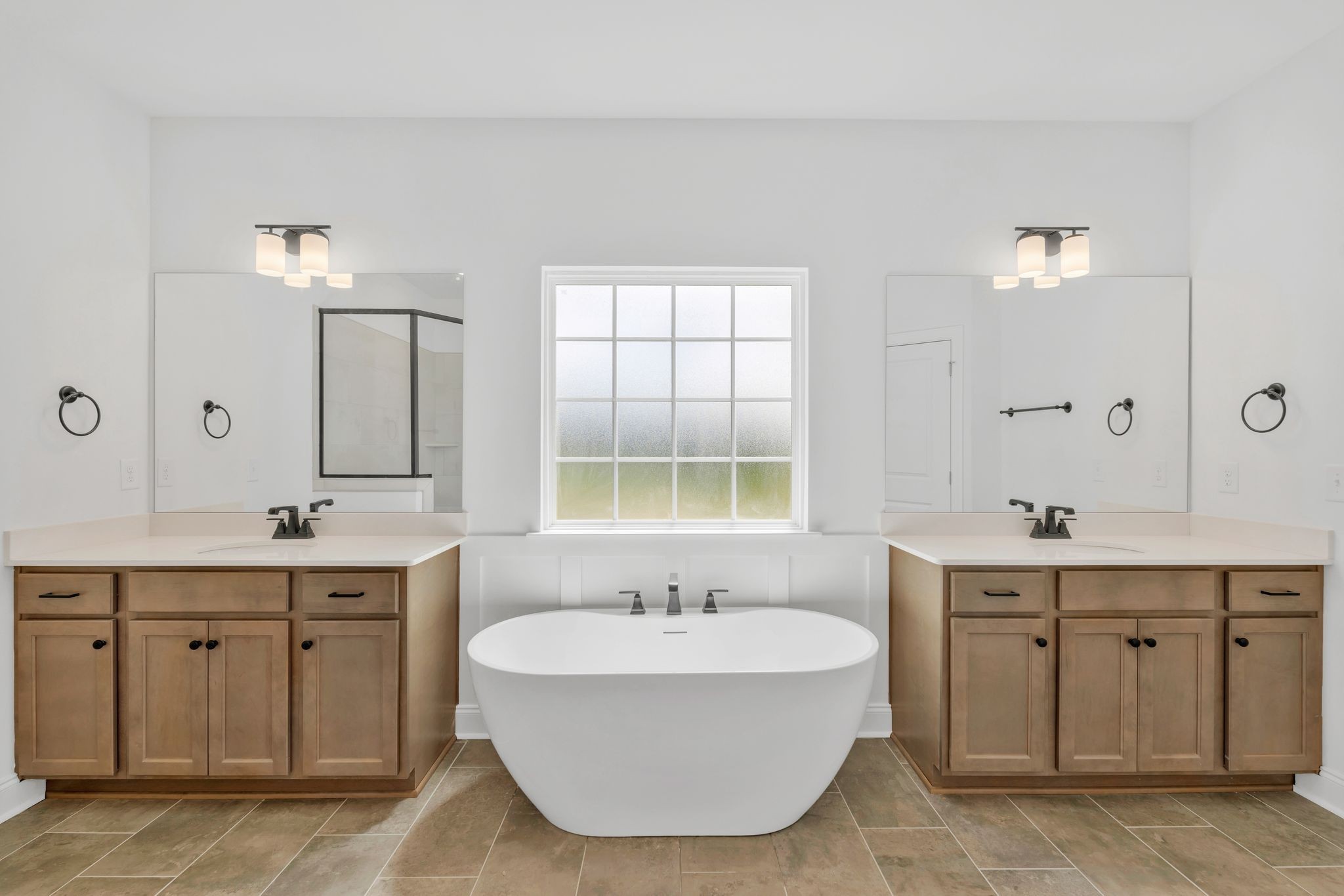 7505 Shoal Mill Point Fairview, TN 37062 - Photo 15 of 55 a spacious bathroom with a double vanity sink mirror and bathtub
