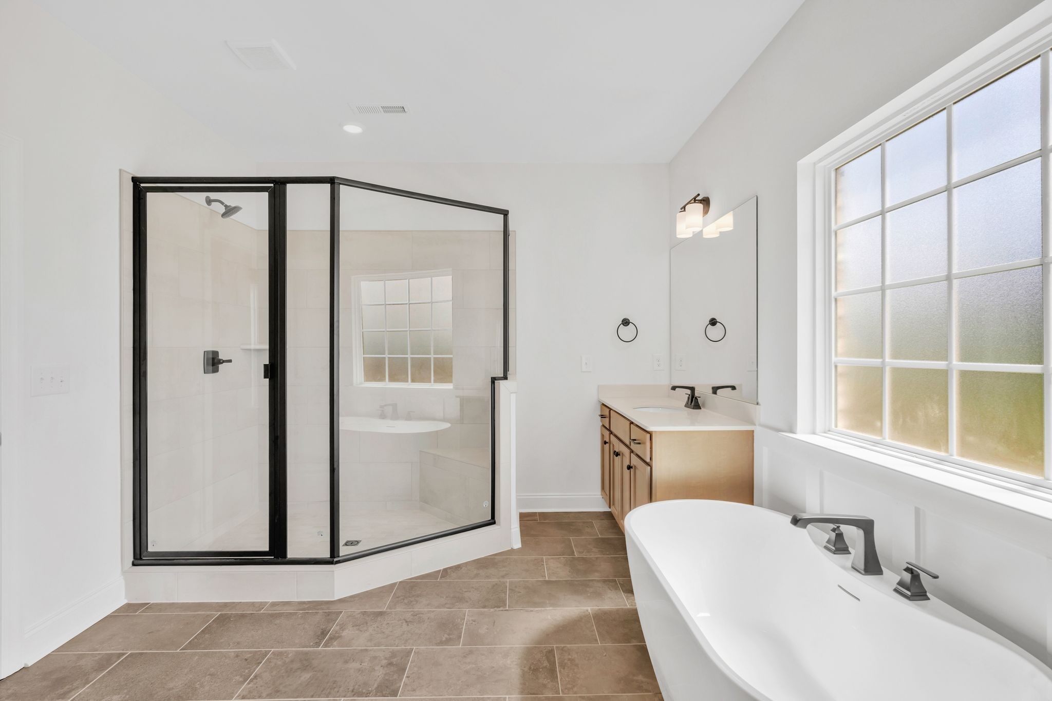 7505 Shoal Mill Point Fairview, TN 37062 - Photo 17 of 55 a bathroom with a tub and shower