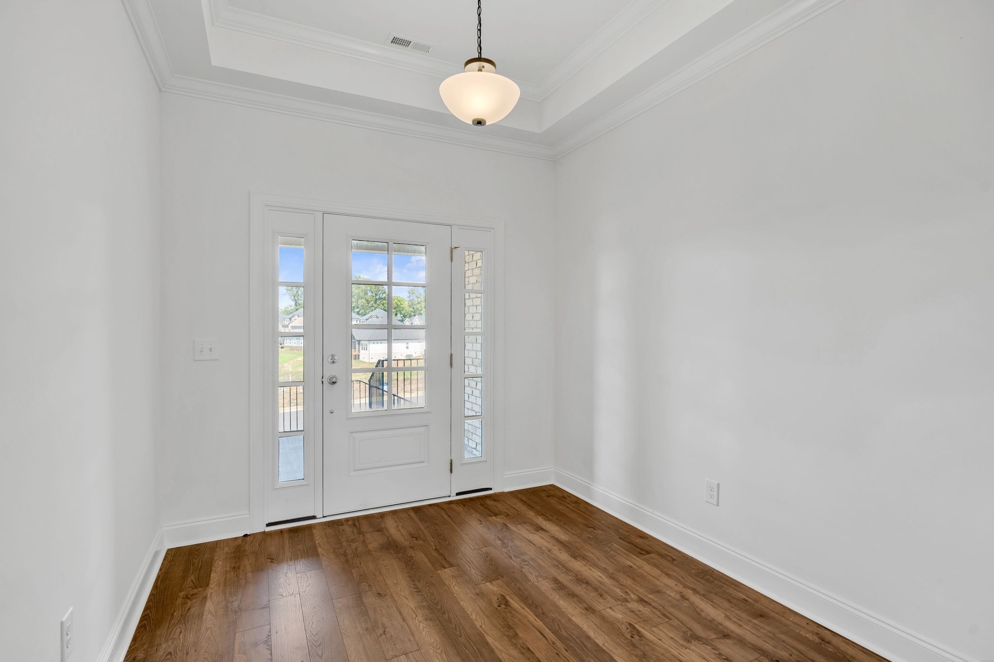 7505 Shoal Mill Point Fairview, TN 37062 - Photo 25 of 55 an empty room with wooden floor and windows