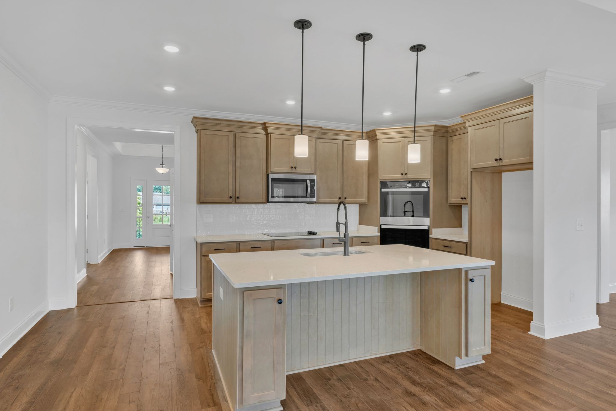 7505 Shoal Mill Point Fairview, TN 37062 - Photo 32 of 55 a kitchen with stainless steel appliances granite countertop a sink a stove and a wooden floors