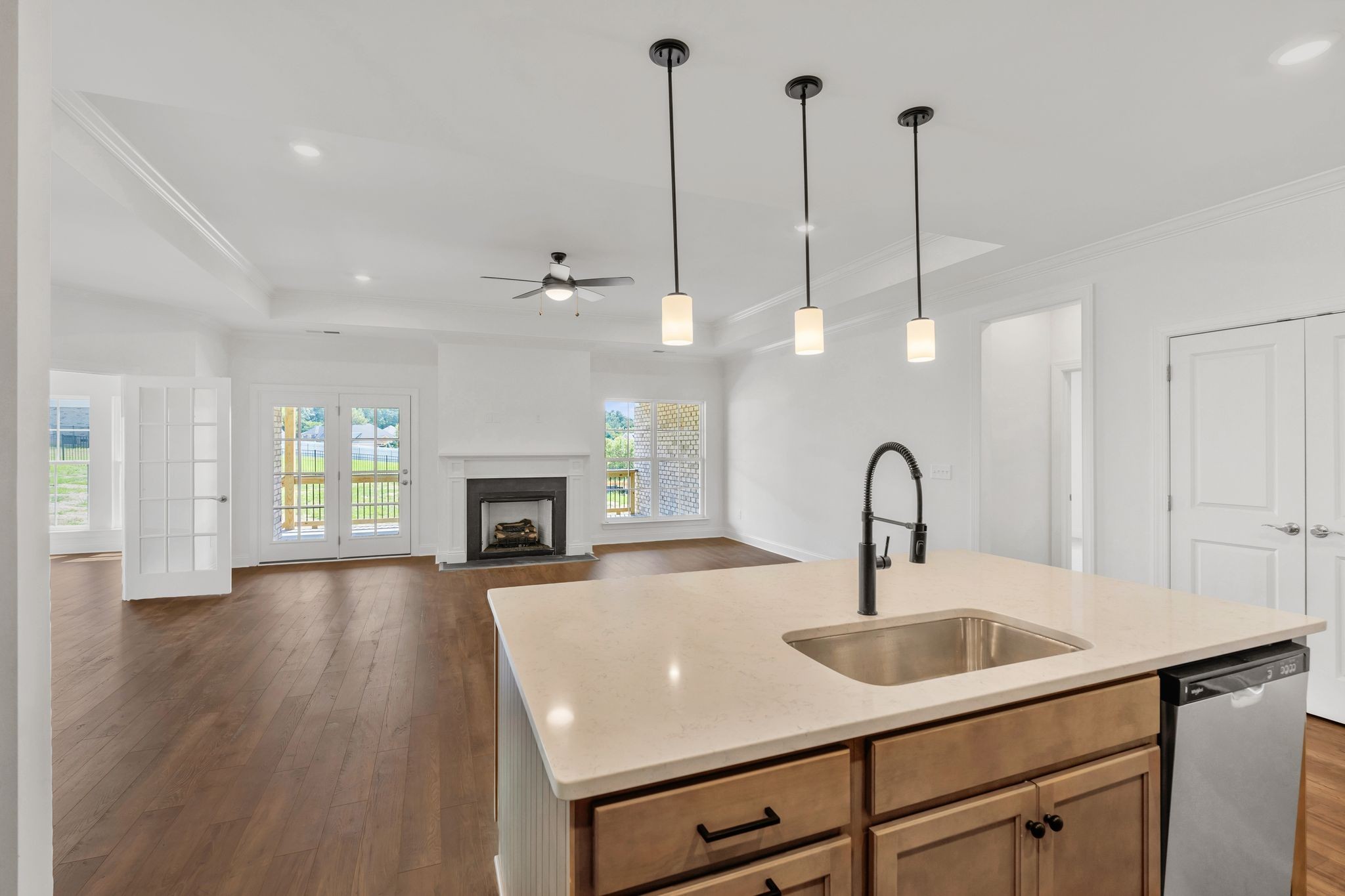 7505 Shoal Mill Point Fairview, TN 37062 - Photo 33 of 55 a view of a kitchen with a sink a fireplace and wooden floor