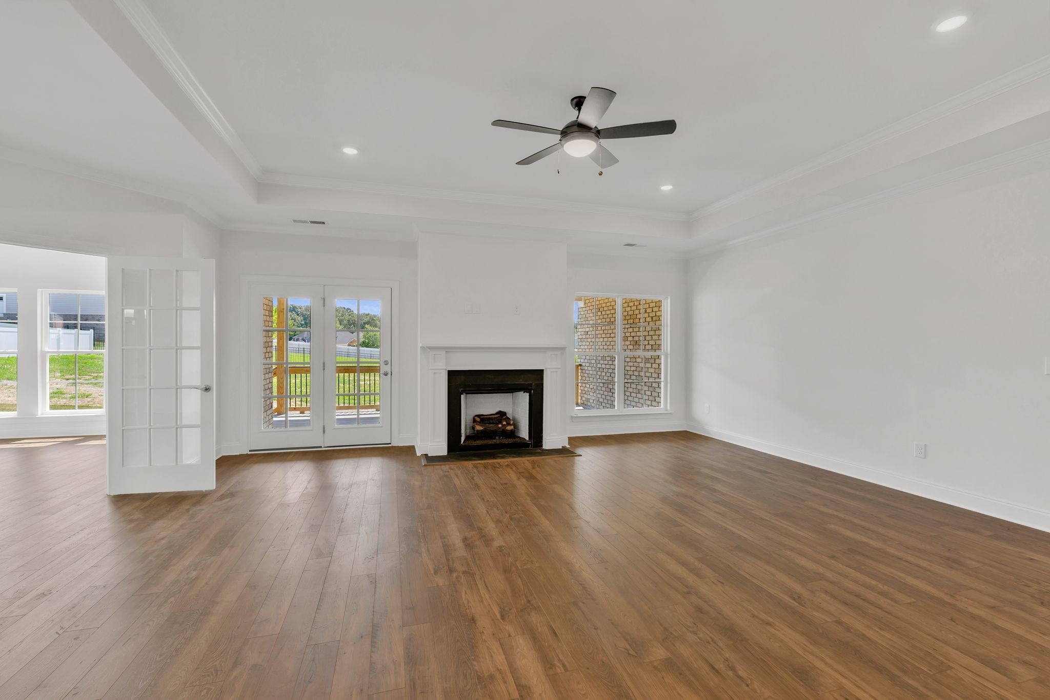7505 Shoal Mill Point Fairview, TN 37062 - Photo 34 of 55 a view of an empty room with a fireplace and a window