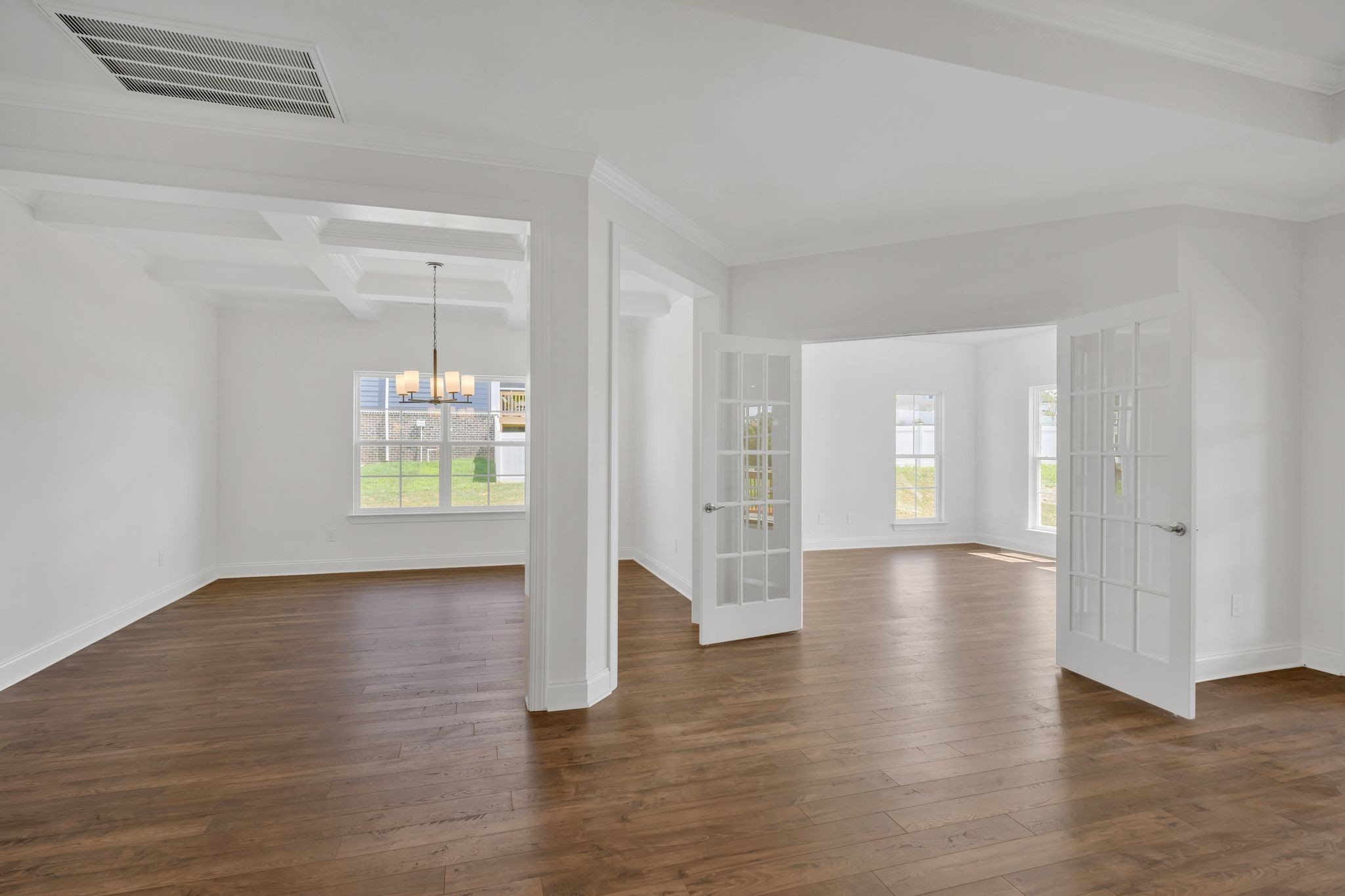 7505 Shoal Mill Point Fairview, TN 37062 - Photo 35 of 55 a view of an empty room with wooden floor and a window