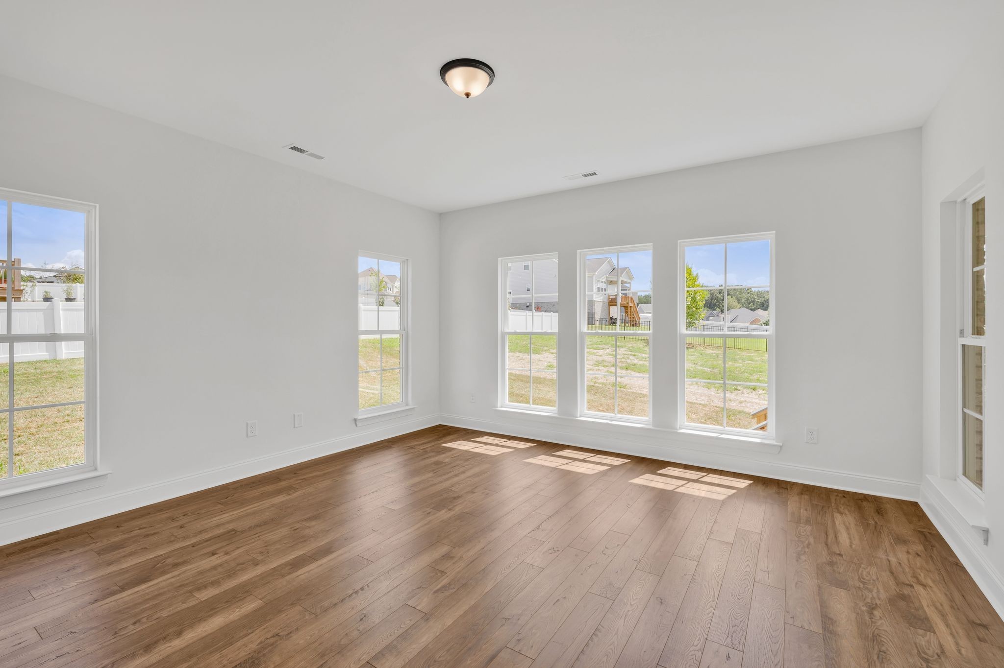 7505 Shoal Mill Point Fairview, TN 37062 - Photo 38 of 55 a view of an empty room with wooden floor and a window