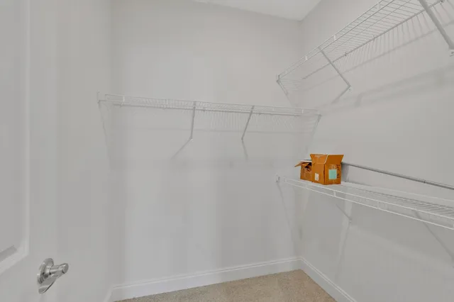 a view of a lake with houses in the background