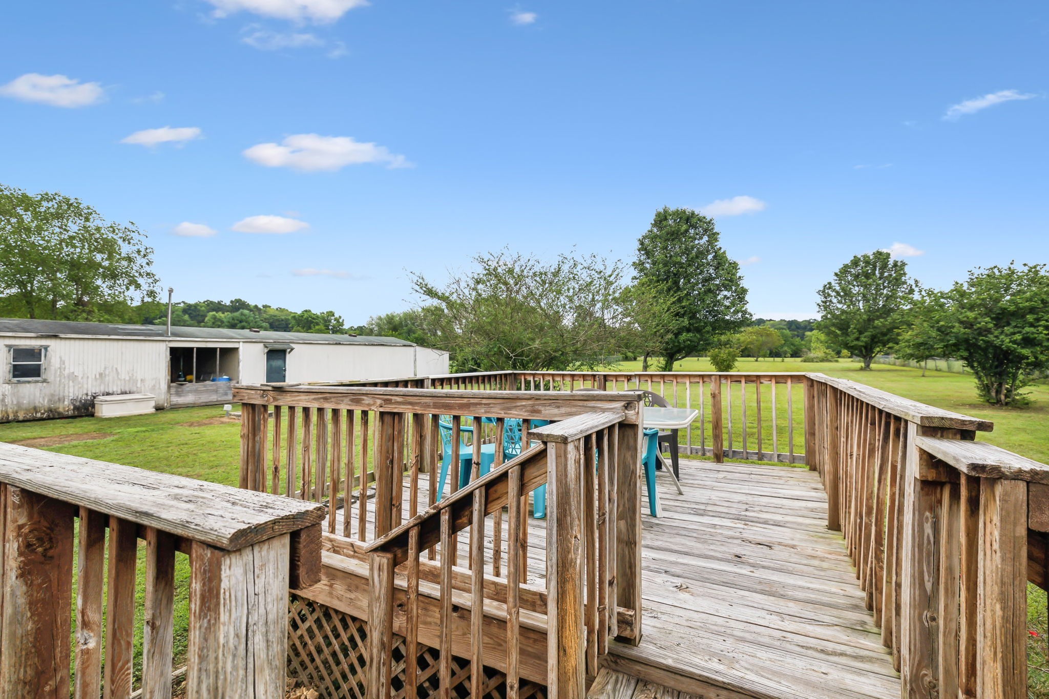 155 Blue Well Road Lebanon, TN 37090 - Photo 30 of 35 a balcony with wooden floor and outdoor seating