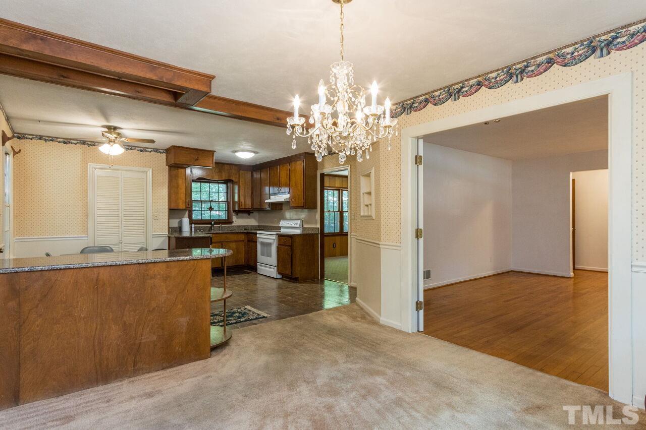 4215 Jane Lane Raleigh, NC 27604 - Photo 8 of 32 a view of a kitchen and a chandelier