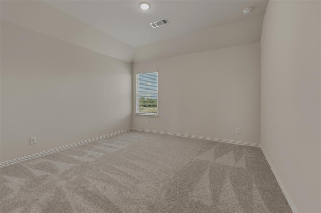 1113 Trinity Drive Springtown, TX 76082 - Photo 21 of 40 Recessed lighting, neutral paint, light gray carpeting, window with blinds