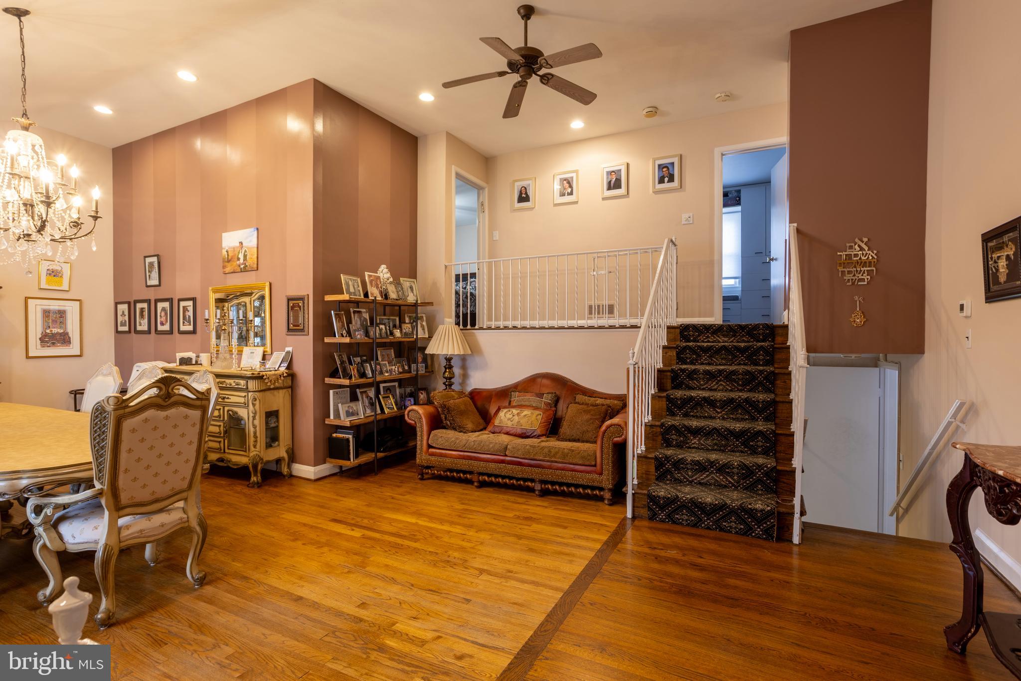 3215 Northbrook Road Baltimore, MD 21208 - Photo 7 of 50 a living room with furniture a ceiling fan and a rug