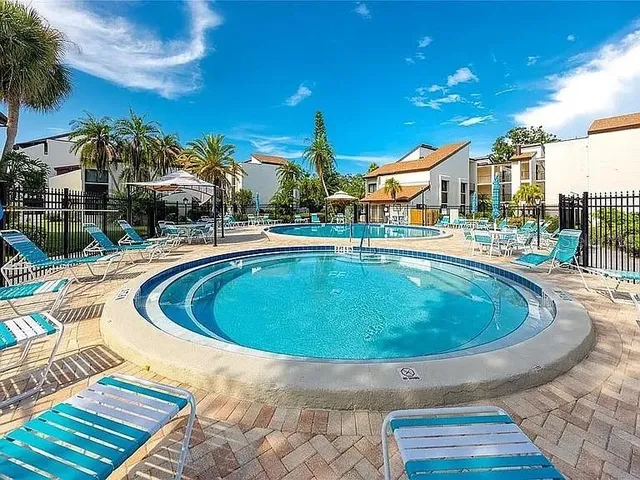 a view of a swimming pool with a patio