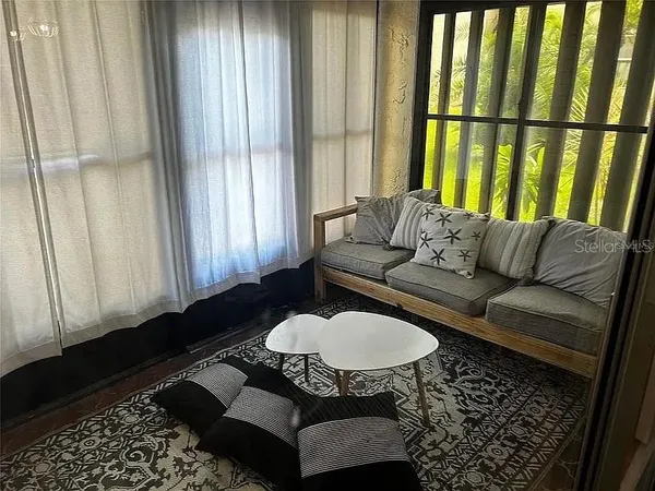 a living room with furniture and a window