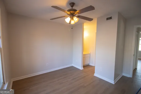 a view of an empty room with a window
