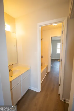 a view of hallway with wooden floor