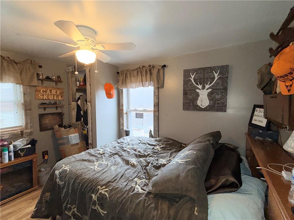 2964 Dawson Run Road West Hickory, PA 16370 - Photo 23 of 39 a bedroom with a bed and a chandelier