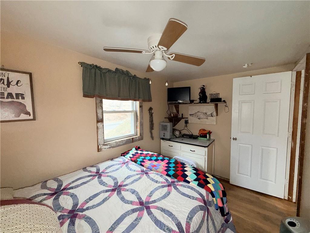 2964 Dawson Run Road West Hickory, PA 16370 - Photo 26 of 39 a bedroom with a bed and a chandelier