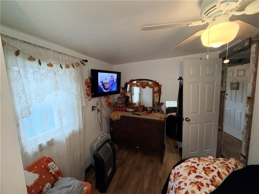 2964 Dawson Run Road West Hickory, PA 16370 - Photo 29 of 39 a bedroom with a bed and a chandelier