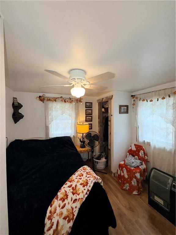 2964 Dawson Run Road West Hickory, PA 16370 - Photo 30 of 39 a bedroom with a bed and wooden floor