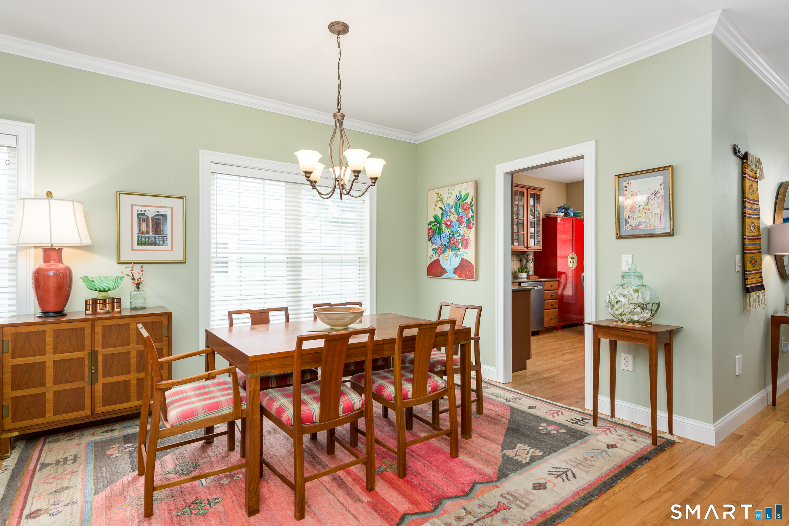 8 Greendale Drive, Unit 8 Suffield, CT 06078 - Photo 17 of 40 a view of a dining room with furniture and a chandelier
