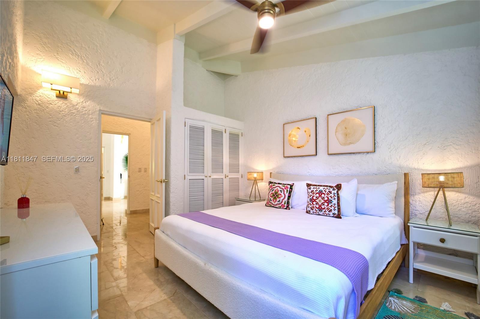 undefined, La Romana 22000 - Photo 8 of 14 a bedroom with a bed and a chandelier