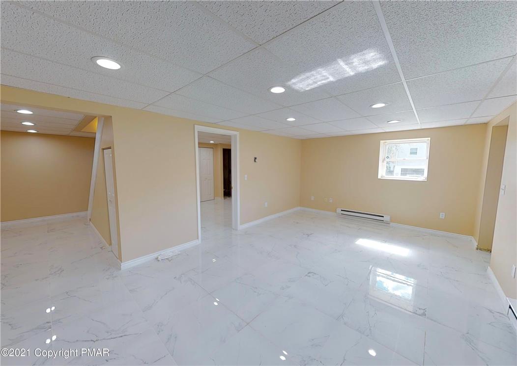 1110 Misty Ridge East Stroudsburg, PA 18302 - Photo 37 of 43 A well-lit, adaptable space with polished tile flooring, ready for your personalized design touches.