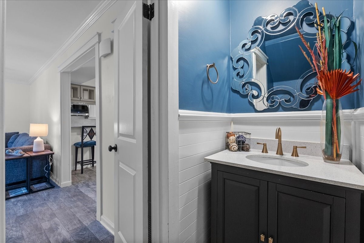1572 Silverpines Road, Unit 572 Houston, TX 77062 - Photo 13 of 37 The half bath downstairs is convenient for guests, and it has been recently updated with rich finishes and a beautiful mirror.