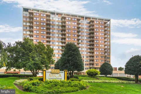 a front view of a building with garden