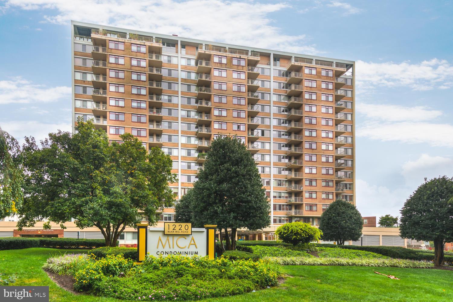 1220 Blair Mill Road, Unit 101 Silver Spring, MD 20910 - Photo 1 of 26 a front view of a building with garden