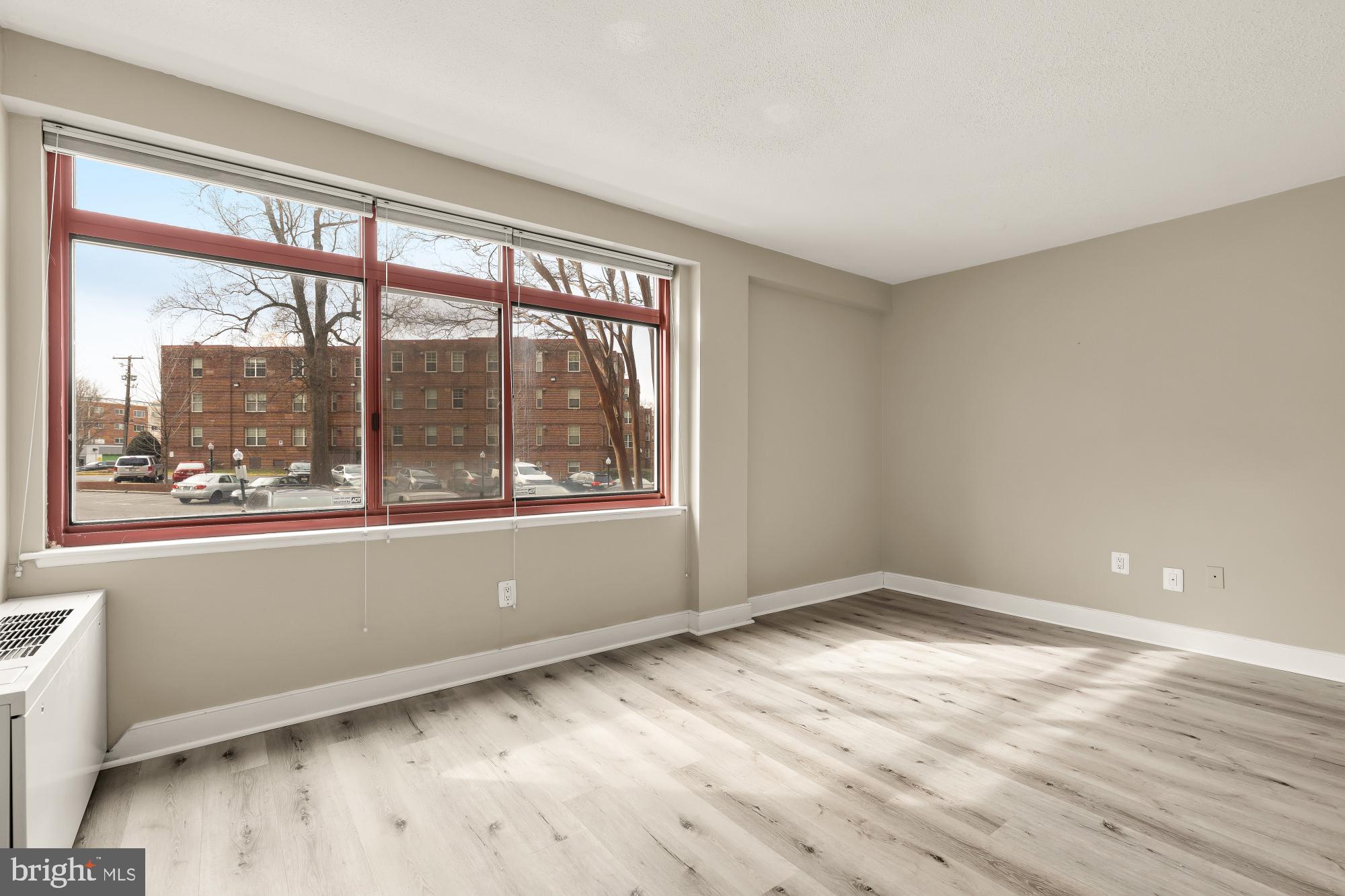 1220 Blair Mill Road, Unit 101 Silver Spring, MD 20910 - Photo 13 of 26 a view of empty room with wooden floor and fan