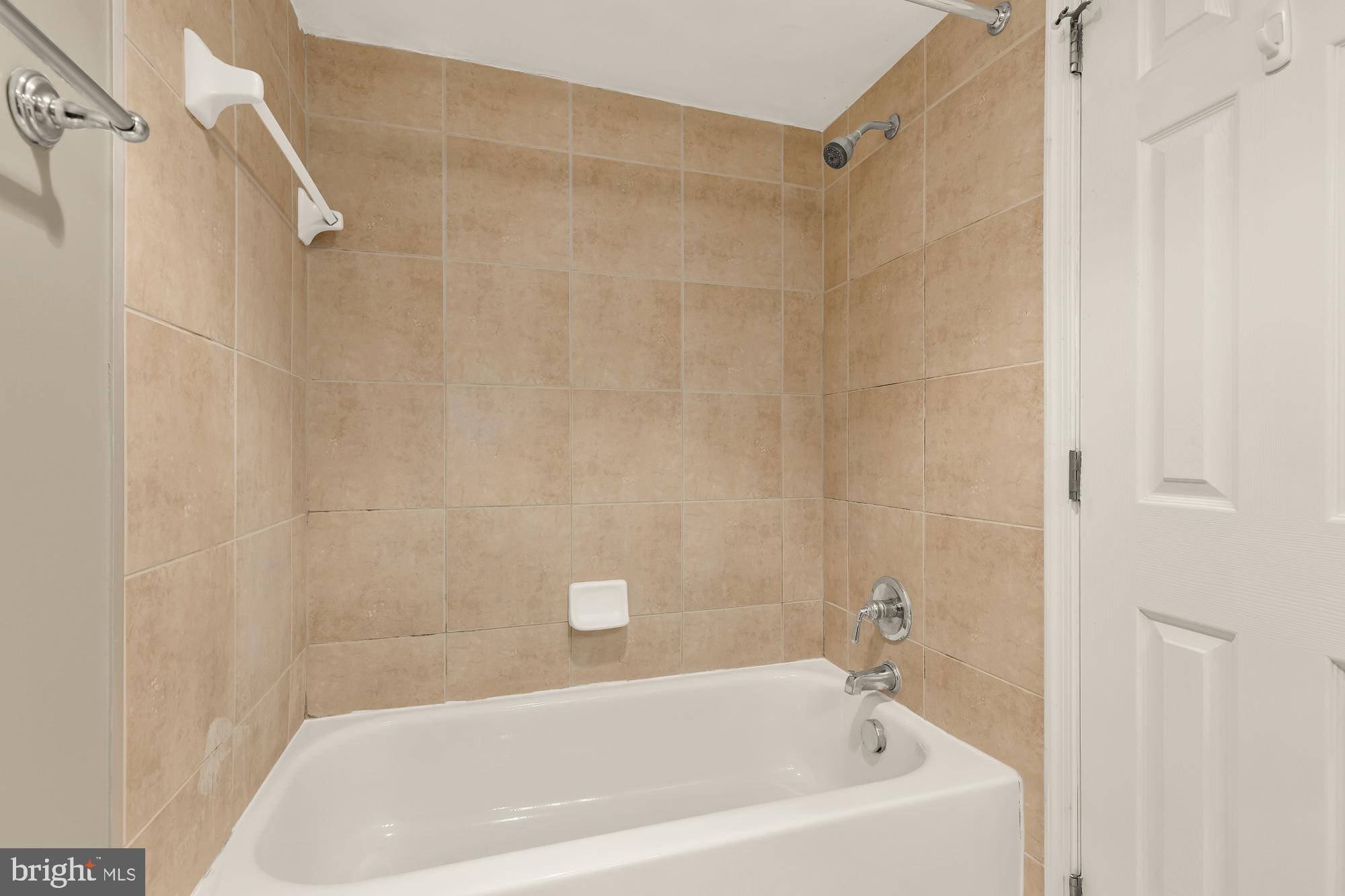 1220 Blair Mill Road, Unit 101 Silver Spring, MD 20910 - Photo 17 of 26 a bathroom with a bathtub