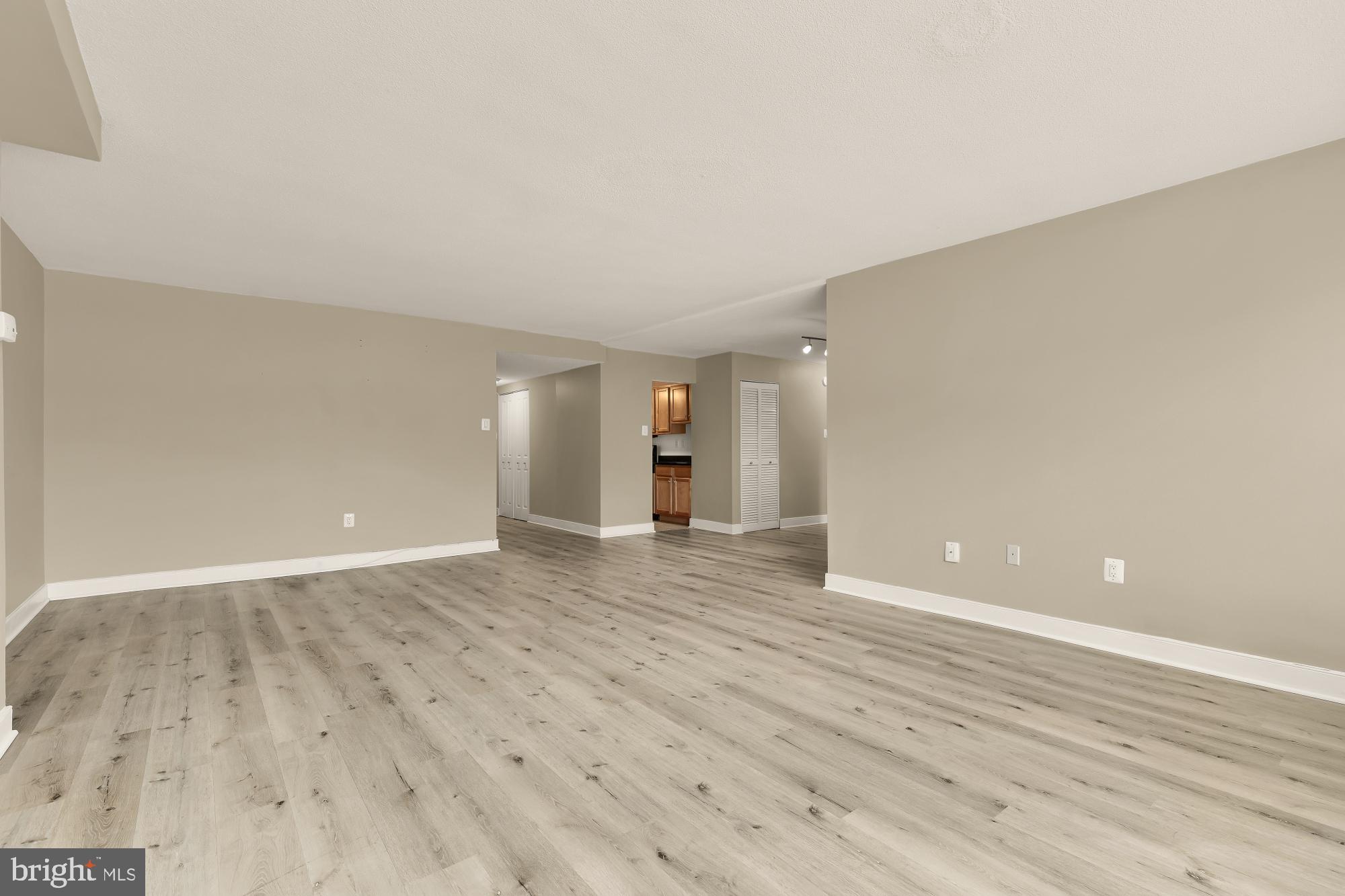 1220 Blair Mill Road, Unit 101 Silver Spring, MD 20910 - Photo 8 of 26 wooden floor in an empty room with wooden floor